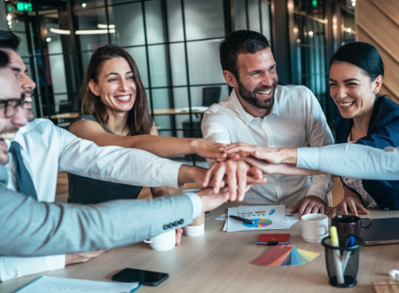 An empowered group of employees working in a corporate setting.